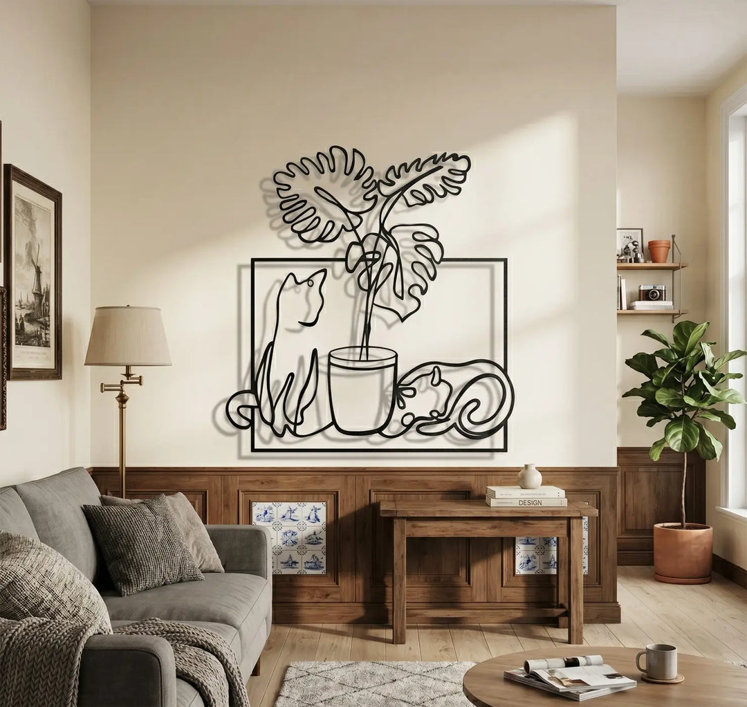 Metalen wanddecoratie woonkamer zwart speelse katten monstera plant botanisch