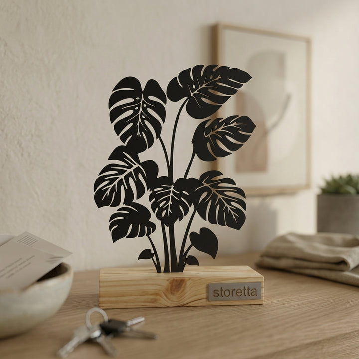 Minimalistisch decoratiebeeld van een Gatenplant, passend bij urban jungle interieurs met mangohout en staal.