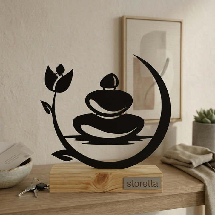 Minimalistisch decoratiebeeld van stenen in evenwicht, passend bij interieurs met mangohout en zwart staal.